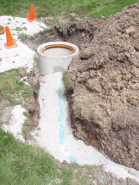 This 6" PVC was used to drain the water from the catch basin. - Bob's Grading Muskego
