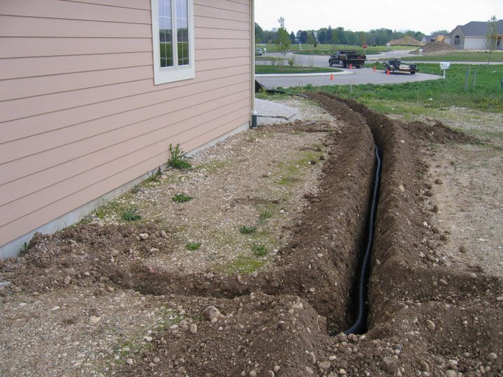 Trenching is one of the best ways to solve drainage issues. - Bob's Grading Muskego